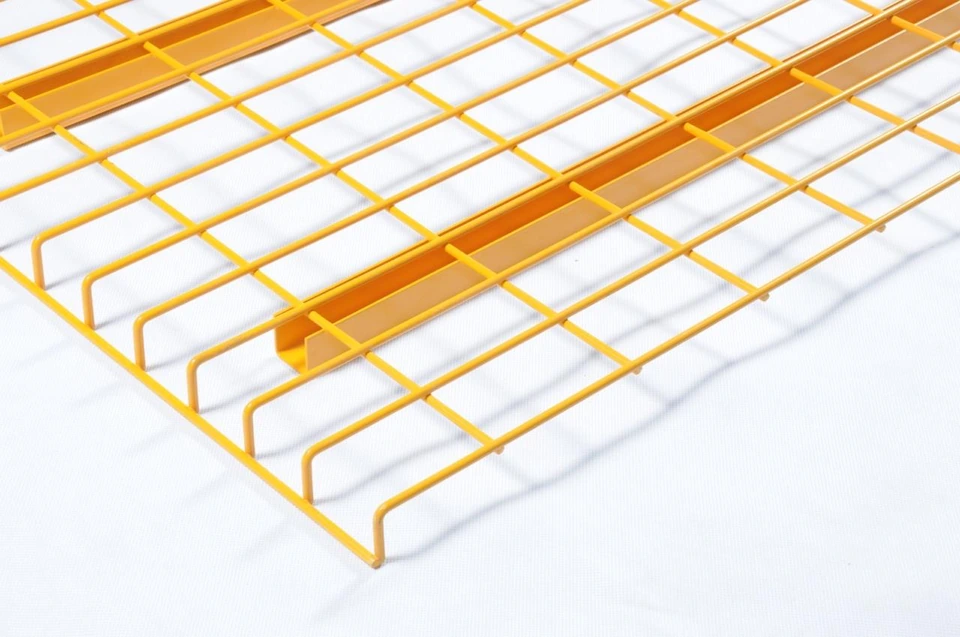 Close-up of pallet rack wire mesh decking showing reinforced support channel construction